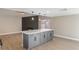 Open-concept living area featuring a fireplace and large island, perfect for entertaining at 1943 Hallwood Dr, Las Vegas, NV 89119