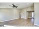 Large living room with neutral tones, wood-look floors, high ceilings and lots of natural light at 1943 Hallwood Dr, Las Vegas, NV 89119