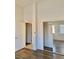 Light and airy bedroom featuring wood floors, closet, and a doorway to another room at 2050 N Los Feliz St # 114, Las Vegas, NV 89156