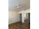 Spacious bedroom featuring wood floors, closet, and a doorway to another room at 2050 N Los Feliz St # 114, Las Vegas, NV 89156