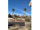 Exterior shot of the community pool area and tall palm trees at 2050 N Los Feliz St # 114, Las Vegas, NV 89156