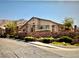 Beautiful community entrance with stone wall, greenery, and 'Moonlight Terrace' sign at 2050 N Los Feliz St # 114, Las Vegas, NV 89156