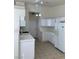 Bright kitchen featuring white appliances, cabinets, and tile countertops and floors for a clean, classic look at 2050 N Los Feliz St # 114, Las Vegas, NV 89156