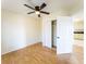 Cozy bedroom with laminate floors, ceiling fan and closet at 211 Kansas Ave, Henderson, NV 89015