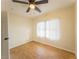 Bedroom featuring a ceiling fan and natural light from a large window at 211 Kansas Ave, Henderson, NV 89015