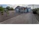 Charming single-story home with a fenced yard and covered porch, perfect for enjoying the outdoors at 211 Kansas Ave, Henderson, NV 89015