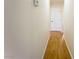 Hallway featuring a door and neutral-toned walls, leading to other areas of the house at 211 Kansas Ave, Henderson, NV 89015