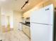 A functional kitchen, fully equipped with a modern refrigerator and range stove at 211 Kansas Ave, Henderson, NV 89015