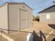 Outdoor storage shed featuring neutral paint, convenient access door and is adjacent to the home at 211 Kansas Ave, Henderson, NV 89015