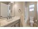 This bathroom features a neutral color palette, a modern vanity, and a combined shower and tub at 2194 Pigeon Hawk St, Las Vegas, NV 89138