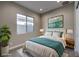 Cozy bedroom featuring a decorative painting, area rug, and bedside tables at 2194 Pigeon Hawk St, Las Vegas, NV 89138