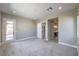 Bedroom boasts neutral walls, carpeted floors, bright light, and dual doors for added privacy at 2194 Pigeon Hawk St, Las Vegas, NV 89138