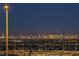 A stunning panoramic view of the sparkling city skyline at night at 2194 Pigeon Hawk St, Las Vegas, NV 89138
