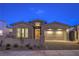 Charming single-story home with a brick driveway and a well-manicured front yard at 2194 Pigeon Hawk St, Las Vegas, NV 89138
