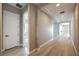 This well-lit hallway features wood floors and neutral paint at 2194 Pigeon Hawk St, Las Vegas, NV 89138