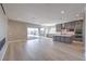 This open kitchen features an island, gray cabinets, and a sliding glass door at 2194 Pigeon Hawk St, Las Vegas, NV 89138