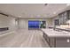This open concept kitchen features an island with a view of the living room at 2194 Pigeon Hawk St, Las Vegas, NV 89138