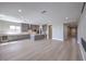 This modern kitchen features an island, gray cabinets, and wood floors at 2194 Pigeon Hawk St, Las Vegas, NV 89138