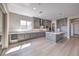 This bright kitchen features gray cabinets, stainless appliances, and an island at 2194 Pigeon Hawk St, Las Vegas, NV 89138