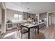 Spacious kitchen featuring stainless steel appliances, an island, and dining area at 2194 Pigeon Hawk St, Las Vegas, NV 89138