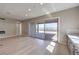 Bright living room area featuring light wood floors, a fireplace and sliding glass door to the outdoor living area at 2194 Pigeon Hawk St, Las Vegas, NV 89138