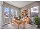 Home office with large windows providing natural light and mountain views at 2194 Pigeon Hawk St, Las Vegas, NV 89138