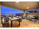 Outdoor patio featuring city views, lounge seating, and an outdoor dining table at 2194 Pigeon Hawk St, Las Vegas, NV 89138