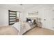 Calm bedroom with a modern bed and stylish sliding barn door to the bathroom at 22 Anthem Pointe Ct, Henderson, NV 89052