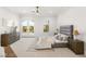 Light bedroom with a modern bed, natural light, and serene outdoor views at 22 Anthem Pointe Ct, Henderson, NV 89052