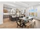 An open-concept kitchen and dining area features modern appliances, a spacious island, and scenic views at 22 Anthem Pointe Ct, Henderson, NV 89052