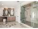 This spacious main bathroom features a custom shower, dual sinks and modern fixtures at 22 Anthem Pointe Ct, Henderson, NV 89052
