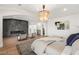 Spacious main bedroom featuring fireplace, sitting area, and en-suite bathroom at 22 Anthem Pointe Ct, Henderson, NV 89052
