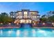 An opulent residence with a stunning pool and waterfall feature provides a luxurious outdoor experience at 22 Anthem Pointe Ct, Henderson, NV 89052