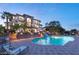 Inviting pool area with cascading waterfall, lounge chairs, and lush landscaping, perfect for relaxing at 22 Anthem Pointe Ct, Henderson, NV 89052