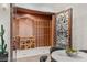 Elegant wine cellar with custom wood racking and decorative iron door at 22 Anthem Pointe Ct, Henderson, NV 89052