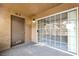 Private patio area with textured walls features sliding glass door entry to living space at 2200 S Fort Apache Rd # 2049, Las Vegas, NV 89117