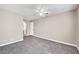 The bedroom boasts neutral paint, carpet, ceiling fan and a door to ensuite bathroom at 2200 S Fort Apache Rd # 2049, Las Vegas, NV 89117