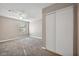 A simple bedroom with ceiling fan, window, neutral colors and large closet at 2200 S Fort Apache Rd # 2049, Las Vegas, NV 89117