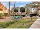 Inviting common area with a green picnic table and gravel landscaping near community buildings at 2200 S Fort Apache Rd # 2049, Las Vegas, NV 89117
