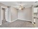 This dining room has carpet flooring and vintage ceiling fan at 2200 S Fort Apache Rd # 2049, Las Vegas, NV 89117
