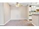Dining room showing access to kitchen with white cabinets and appliances at 2200 S Fort Apache Rd # 2049, Las Vegas, NV 89117