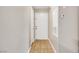 A tiled entryway includes a white front door with adjacent utility panel and lighting at 2200 S Fort Apache Rd # 2049, Las Vegas, NV 89117