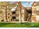 Attractive condo building featuring desert landscaping, walkways, and staircases to upper level units at 2200 S Fort Apache Rd # 2049, Las Vegas, NV 89117