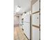 Galley kitchen with white cabinets and appliances, and tile floors at 2200 S Fort Apache Rd # 2049, Las Vegas, NV 89117