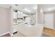 Kitchen featuring white cabinetry, tile floors, and breakfast bar at 2200 S Fort Apache Rd # 2049, Las Vegas, NV 89117