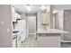 Kitchen features white cabinets, a breakfast bar, and tile flooring at 2200 S Fort Apache Rd # 2049, Las Vegas, NV 89117
