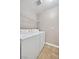 Functional laundry room features a washer, dryer, and shelving for convenient storage at 2200 S Fort Apache Rd # 2049, Las Vegas, NV 89117