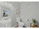 Cozy bathroom features a pedestal sink, tiled floors, and updated fixtures at 2325 Windmill Pkwy # 1124, Henderson, NV 89074