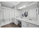 Bathroom with double sinks, modern fixtures, and a shower-tub combination and walk in closet at 2325 Windmill Pkwy # 1124, Henderson, NV 89074