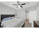 Bright bedroom featuring carpet, ceiling fan, and access to the ensuite bathroom at 2325 Windmill Pkwy # 1124, Henderson, NV 89074